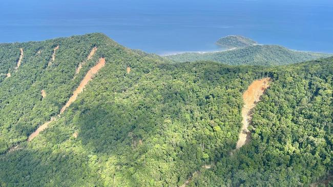 Scarred mountainsides highlight the damage done by Tropical Cyclone Jasper and the Far North floods near Cape Tribulation. (Michael Kerr)