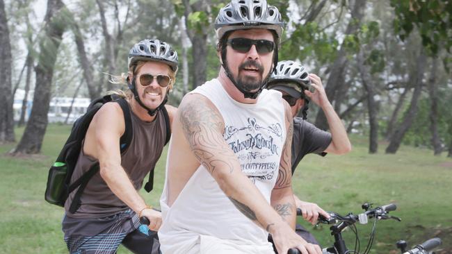 Foo Fighters frontman Dave Grohl (right) and drummer Taylor Hawkins and some mates ride around the Gold Coast in 2015. Picture: Tim Marsden