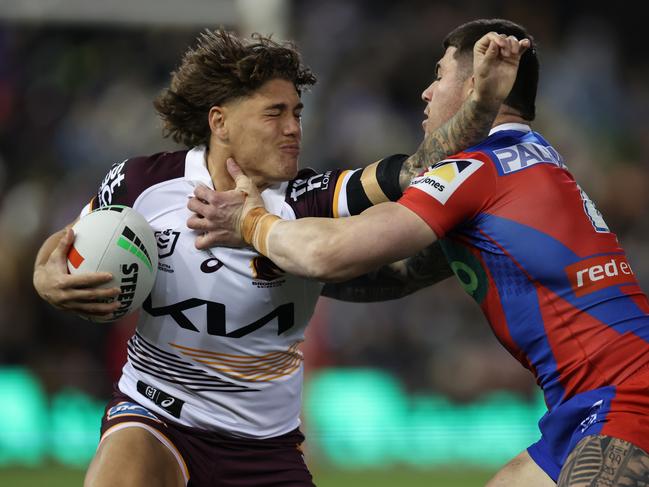 NEWCASTLE, AUSTRALIA - JULY 20: Reece Walsh of the Broncos is tackled by Bradman Best of the Knights during the round 20 NRL match between Newcastle Knights and Brisbane Broncos at McDonald Jones Stadium, on July 20, 2024, in Newcastle, Australia. (Photo by Scott Gardiner/Getty Images)