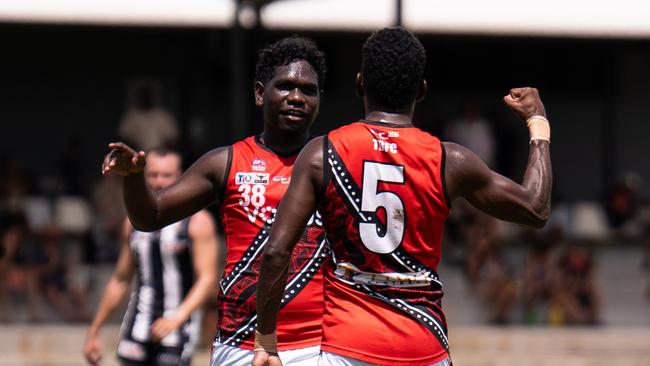 William Munkara and Kim Kantilla celebrate a goal for the Tiwi Bombers in the 2024-25 NTFL season. Picture: Jack Riddiford / AFLNT Media