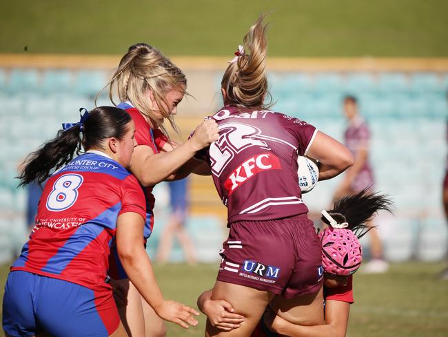 Tahlee Maroney is tackled. Picture: Warren Gannon Photography