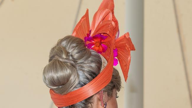 Fashionista Kymberlee Cockrem suggests that big hats can be unwieldy at times, such as when sitting down to lunch. Picture: Heather York.