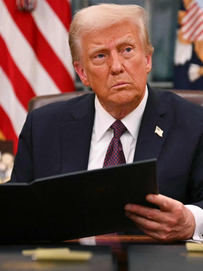 US President Donald Trump signing an executive order for pardons for January 6 offenders shortly after his swearing-in ceremony. Picture: AFP