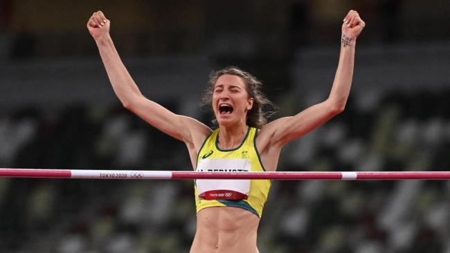 McDermott celebrates her medal-clearing jump.