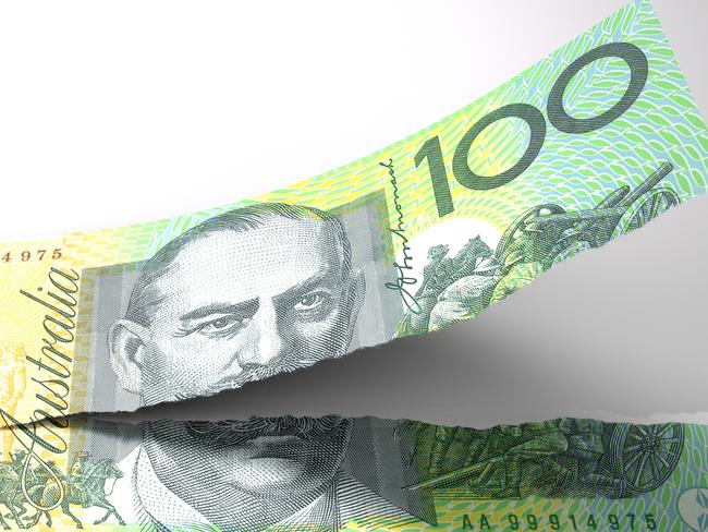 A concept picture of a regular australian one hundred dollar note tearing in two length ways on an isolated background;  money generic