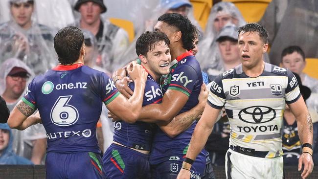 BRISBANE, AUSTRALIA - MAY 03: Luke Metcalf of the Warriors celebrates with team mates after scoring a try during the round nine NRL match between the New Zealand Warriors and North Queensland Cowboys at Suncorp Stadium on May 03, 2025, in Brisbane, Australia. (Photo by Hannah Peters/Getty Images)