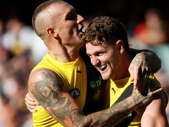 ADELAIDE, AUSTRALIA - MARCH 25: Jacob Hopper and Dustin Martin of the Tigers celebrate a goal during the 2023 AFL Round 02 match between the Adelaide Crows and the Richmond Tigers at Adelaide Oval on March 25, 2023 in Adelaide, Australia. (Photo by James Elsby/AFL Photos via Getty Images)