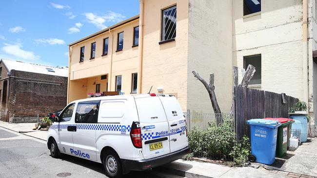 Police back at the King St flat on Sunday afternoon. Picture: Danny Aarons