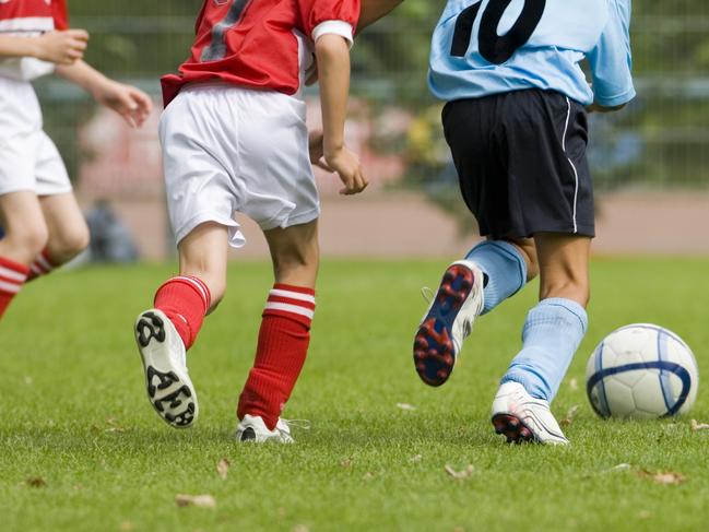 Detail of a soccer game with four players in action