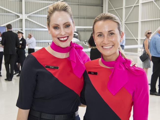 Qantas cabin crew Bridget Zizza and Alyssa Carson at the official opening of Qantas Group Pilot Academy at Wellcamp Airport in January. It is not known which Qantas staff will lose their jobs as a result of today’s announcement.