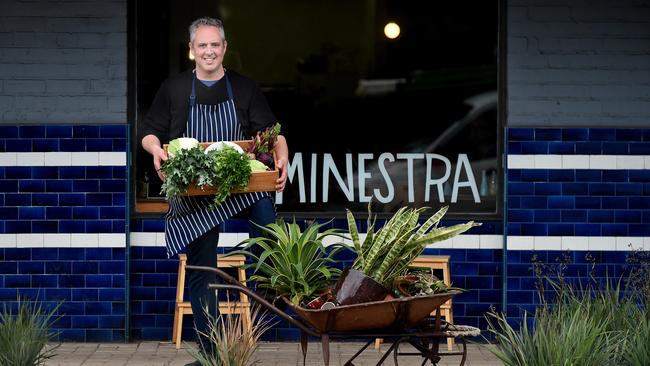 Minestra owner Sandy Cenin in front of the cafe, with a bounty of local produce. Picture: Roy VanDerVegt