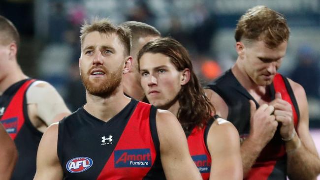 GEELONG, AUSTRALIA - JULY 02: The Bombers look dejected after a loss during the 2021 AFL Round 16 match between the Geelong Cats and the Essendon Bombers at GMHBA Stadium on July 2, 2021 in Geelong, Australia. (Photo by Michael Willson/AFL Photos via Getty Images)