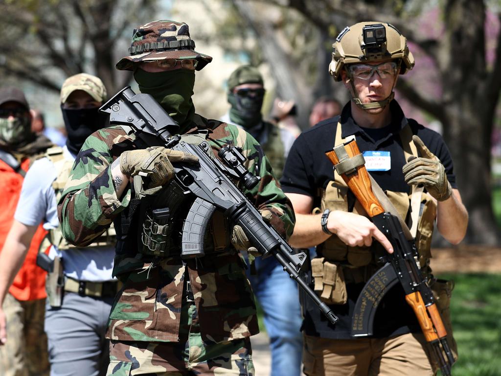 Armed veterans demonstrate in front of the state capital building in Topeka, Kansas demanding that businesses be allowed to open up. Picture: Jamie Squire/Getty Images/AFP