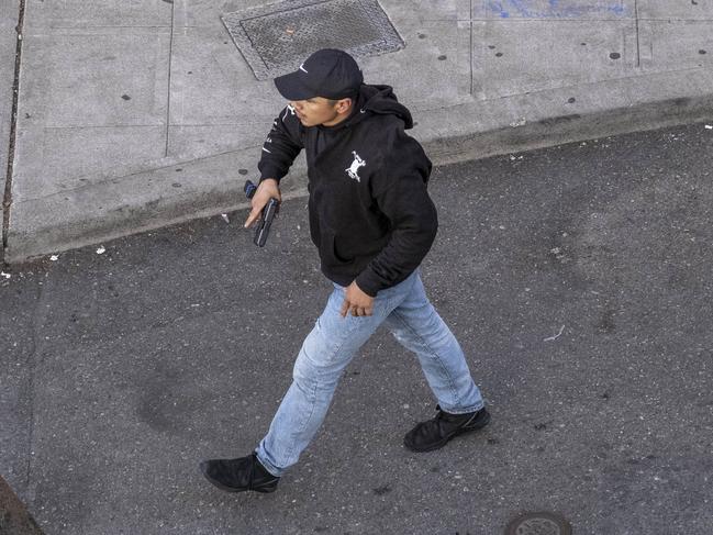 A man holds a firearm after having driven at George Floyd protesters. Picture: Dean Rutz/The Seattle Times via AP