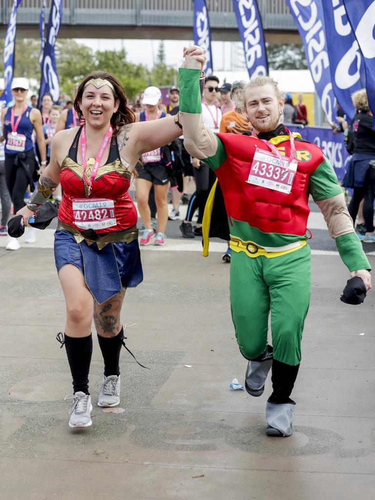 Super heroes Rhain Haisman and Matt Knudsen from the Gold Coast finish the Gold Coast Airport Fun Run. Picture: Tim Marsden.