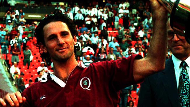 Queensland captain Peter Slattery with the 1995 Super 10 trophy.