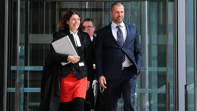 Tolga Kumova leaving the Federal Court in Sydney with his legal team on Monday. Picture: Gaye Gerard.