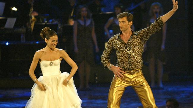 Jackman coaxes Sarah Jessica Parker up for some Tony Awards audience participation. Picture: Frank Micelotta/Getty