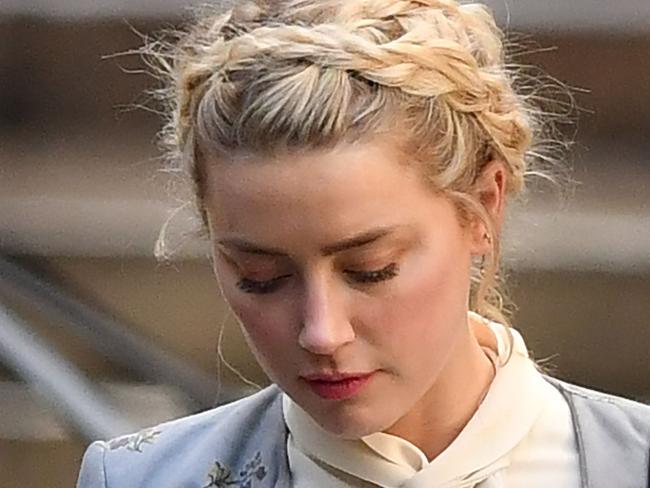 US actress Amber Heard leaves after giving evidence at the libel trial by her former husband US actor Johnny Depp against News Group Newspapers (NGN), at the High Court in London, on July 21, 2020. - Depp is suing the publishers of The Sun and the author of the article for the claims that called him a "wife-beater" in April 2018. (Photo by JUSTIN TALLIS / AFP)