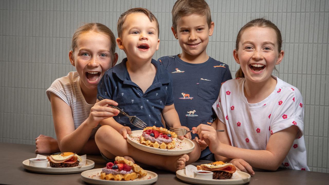 Zoe Munro, Benjamin Raethke, Ethan Raethke and Lucy Munro at Nodo Newstead with the range of healthy kids breakfast options. Picture: Brad Fleet