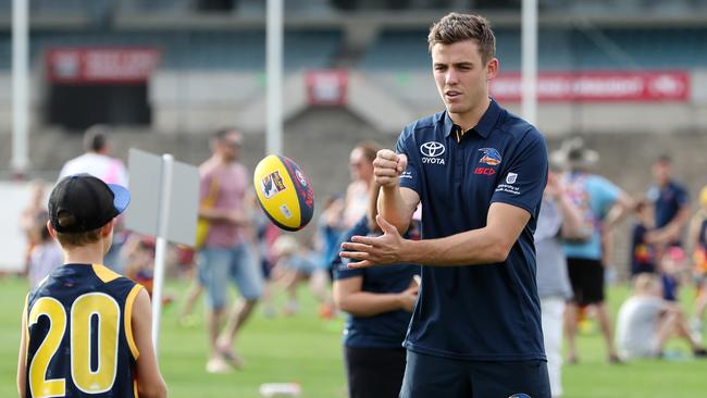 Paul Seedsman doing some drills with junior members at the Crows annual member's day on Monday. Picture: DYLAN COKER