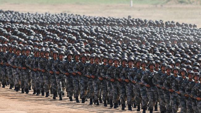 Chinese soldiers march in a military parade to mark the 90th anniversary of the People's Liberation Army in a display of military might. Picture: AFP