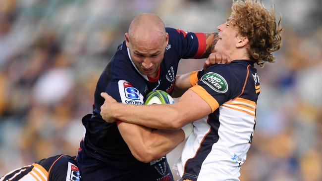 Billy Meakes is wrapped up by the Brumbies’ Joe Powell. Picture: AAP