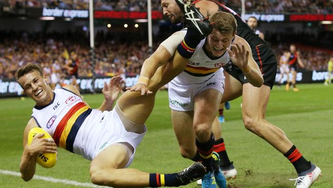 Adelaide's Tom Doedee collides with teammate Adelaide's Matt Crouch in the marking contest. Picture: Michael Klein