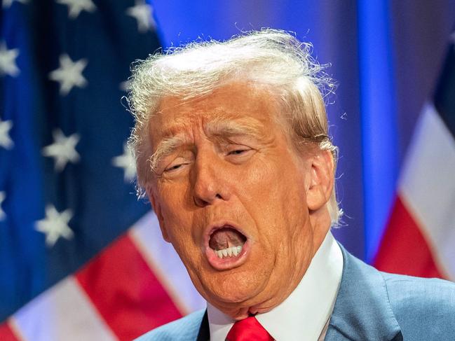 US President-elect Donald Trump gestures as he attends a meeting with House Republicans at the Hyatt Regency hotel in Washington, DC on November 13, 2024. (Photo by Allison ROBBERT / AFP)