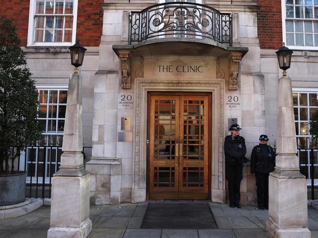 Police officers stand guard outside the London Clinic. Picture: AFP