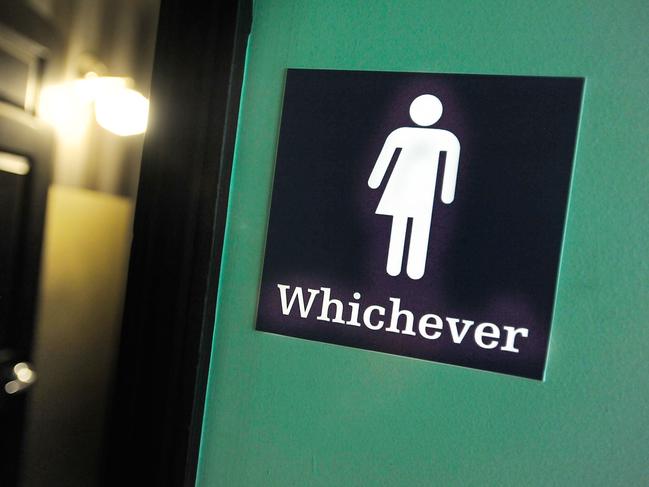 (FILES) This file photo taken on May 10, 2016 shows a gender neutral sign posted outside a bathroom at Oval Park Grill in Durham, North Carolina. Germany's top court on November 8, 2017 required parliament to legally recognise a "third gender" from birth, potentially making it the first European country to offer intersex people the option of identifying as neither male nor female. / AFP PHOTO / GETTY IMAGES NORTH AMERICA / SARA D. DAVIS