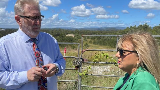 Coomera LNP MP Michael Crandon and Deputy Mayor Donna Gates discussing a petition calling for construction of next stages of the Coomera Connector.