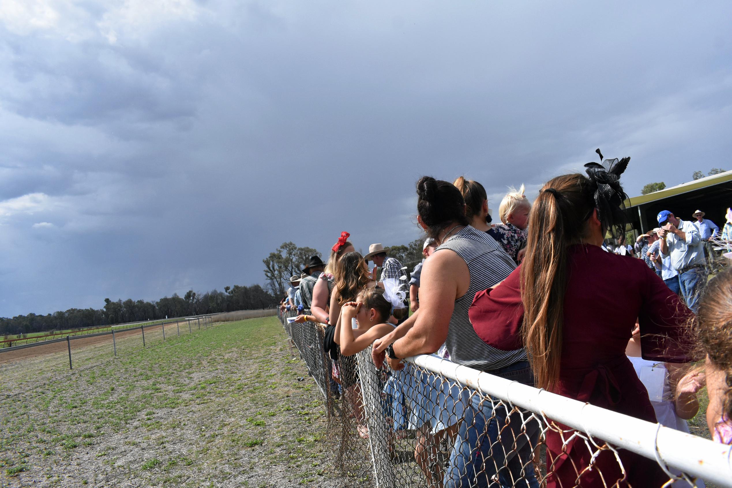 Punters awaiting the final race, before the inclement weather set in. Picture: Jorja McDonnell