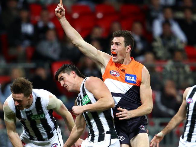 SYDNEY, AUSTRALIA - JULY 20: Jeremy Cameron of the Giants celebrates kicking a goal over Scott Pendlebury of the Magpies during the Greater Western Sydney Giants and the Collingwood Magpies at GIANTS Stadium on July 20, 2019 in Sydney, Australia. (Photo by Cameron Spencer/Getty Images)