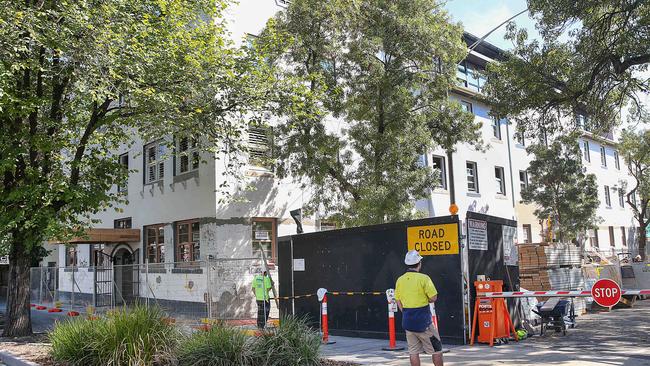 Hoardings have finally been removed from the former flophouse. Picture: Ian Currie