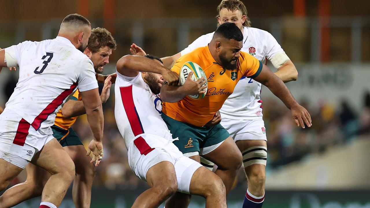 Taniela Tupou tries to break the England defence. Picture: Cameron Spencer/Getty Images