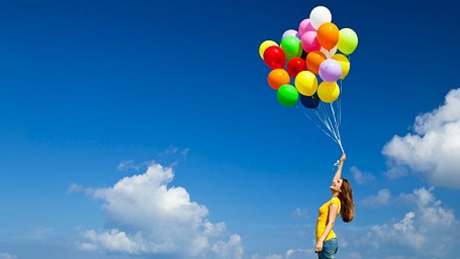 Girl with colourful balloons