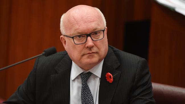 Senator George Brandis is right on the money when he conceded – privately, he thought – the LNP might well return to two separate parties. Picture: AAP