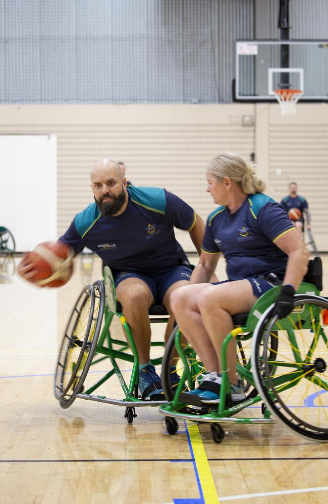 Invictus Games 2025 Team Australia competitor Sue Osborn attempts to tackle Torben Louwen-Skovdam during a wheelchair basketball training session held at the Australian Institute of Sport, in Canberra.