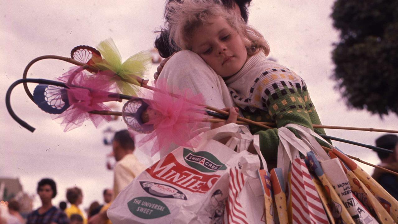 Leesa Milgate,5, from Chermside, worn out after a big day at the show in 1969. Picture: Len Drummond