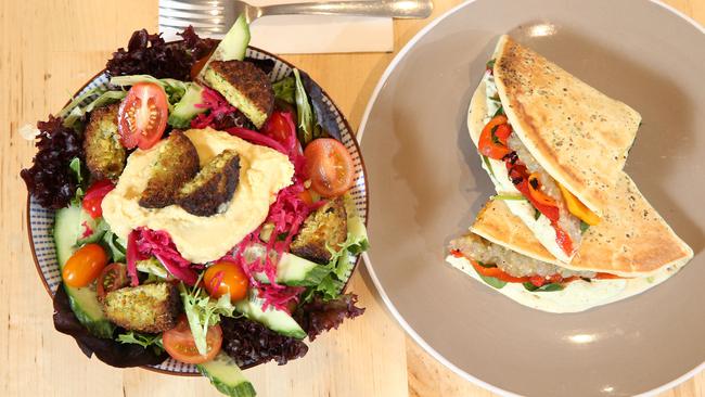 Falafel and hummus salad (left) and roast vegetable za’atar manoushe (right), at The Middle Store, in Melrose Park. Picture: Stephen Laffer