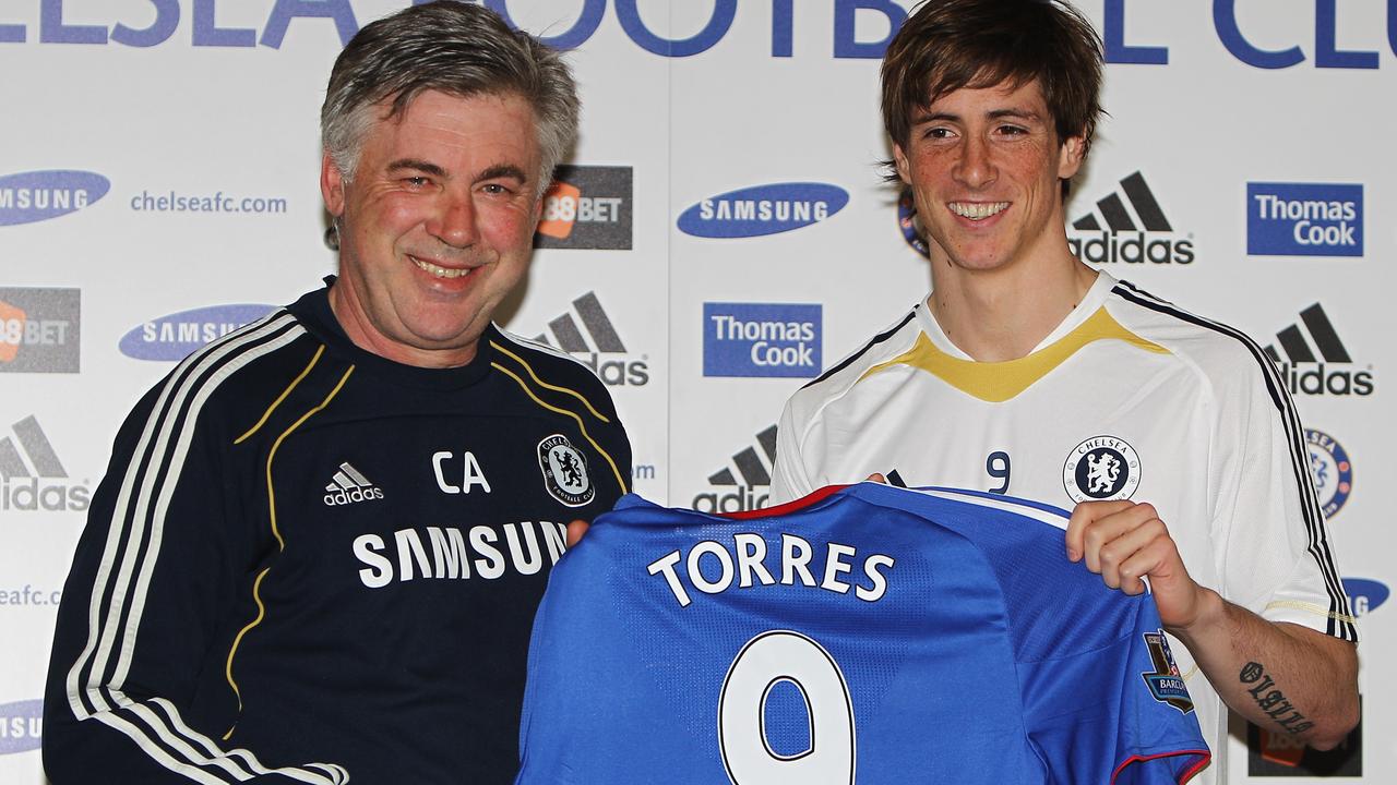 Manager Carlo Ancelotti (L) and Fernando Torres pose for the media in 2011.