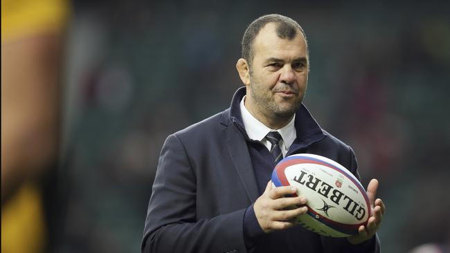 Australia's head coach Michael Cheika watches his players warm-up before the rugby union international between England and Australia at Twickenham in London, Saturday, Nov. 24, 2018. (AP Photo/Tim Ireland)