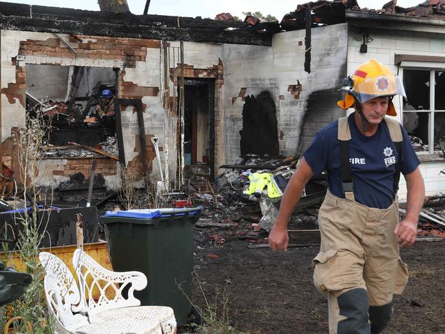 Fire investigators at 9 Yorkshire Street, Grange, where house was destroyed by fire overnight. 5 January, 2019. (AAP Image/Dean Martin)