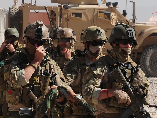 Special Operations Task Group (SOTG) soldiers move to board a United States UH-60 Black Hawk helicopter. Soldiers from the Special Operations Task Group (SOTG) and the Afghan Provincial Response Company (PRC) recently conducted partnered operations in the Shah Wali Kot Region of northern Kandahar province, Afghanistan. The missions, a continuation of the strike and disrupt activities conducted previously, saw the partnered forces successfully capture insurgents, numerous weapons and material for the manufacture of Improvised Explosive Devices (IEDs). Partnered operations between SOTG and the PRC place pressure on the insurgency and have an impact on the Taliban's ability to threaten the lives of Afghan civilians, the Afghan Forces and members of the International Stabilisation Assistance Force (ISAF). Photo by: Corporal (CPL) Chris Moore.