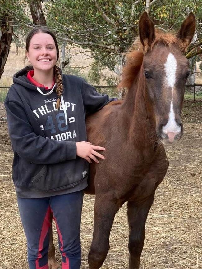 Amy with her horse Dexter which she bought as a foal. Picture: Supplied