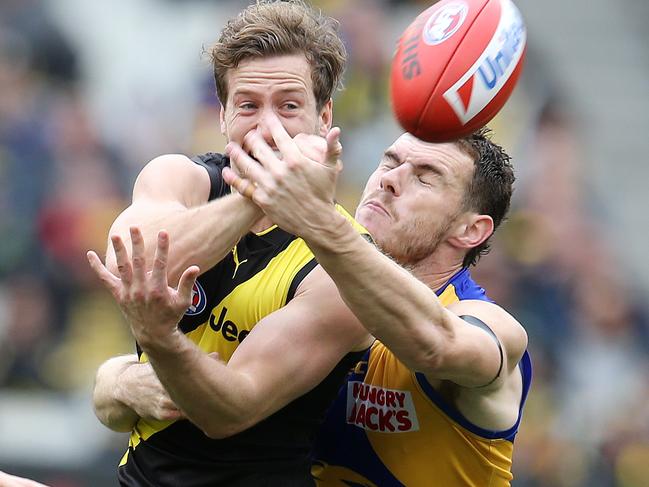 AFL Round 22. 18/08/2019. Richmond v West Coast at the MCG .   Richmonds Kane Lambert  clears infant of West Coast's Luke Shuey    . Pic: Michael Klein