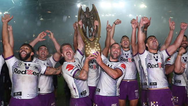 Victory is sweet. Melbourne Storm celebrate their premiership. Picture: Brett Costello