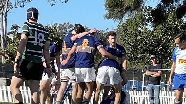 Churchie players celebrate on of Mac Kelley's three tries.