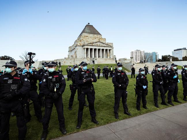 Police officers stood guard as anti lockdown protesters gathered at the Shrine of Remembrance on Saturday in Melbourne. (Photo by Darrian Traynor/Getty Images)